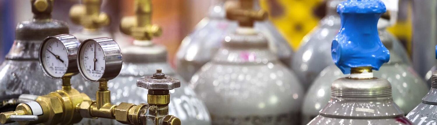 Close up view of shiny grey gas cylinders