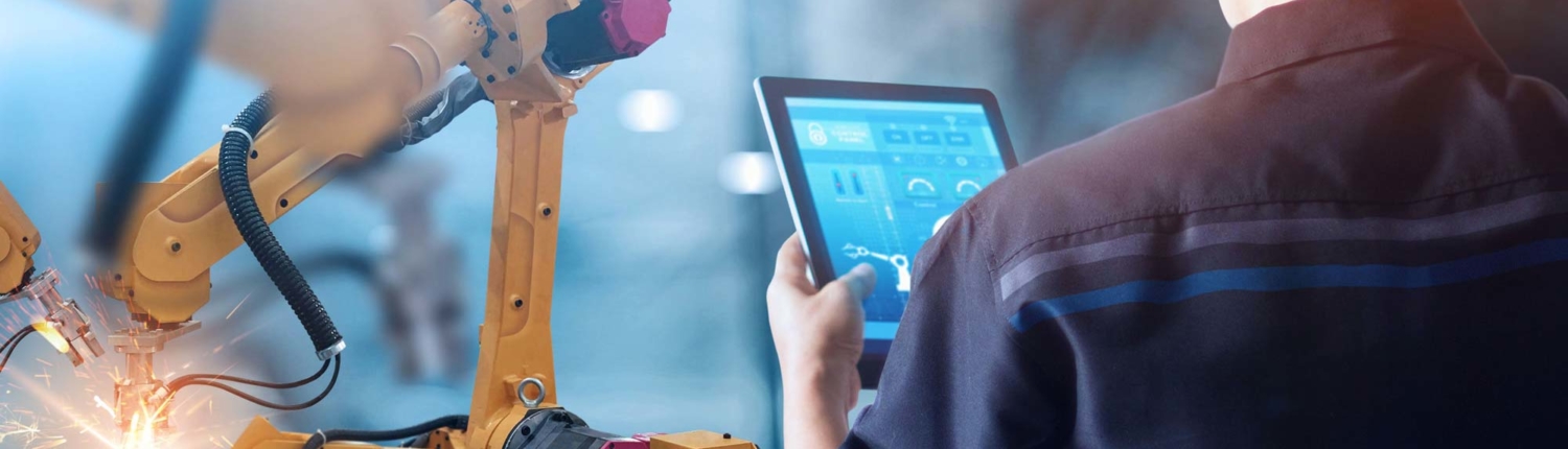 June-Blog-1 welding operator reviewing processes on a tablet