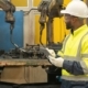 welding operator reviewing equipment