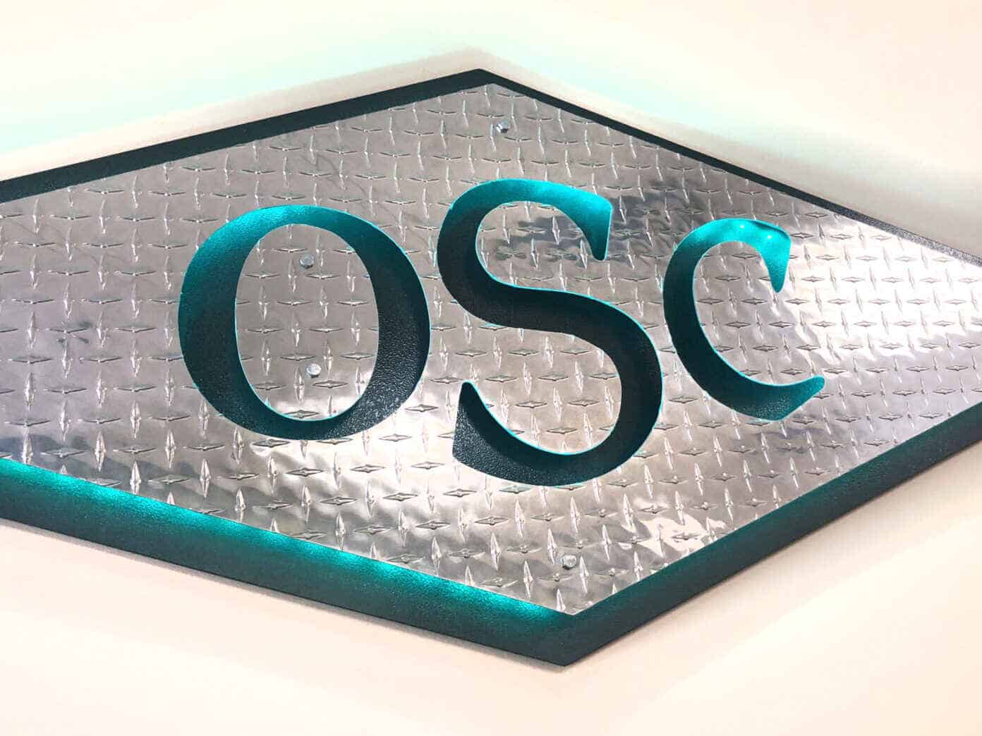 OCS Green sign thats handing in the office