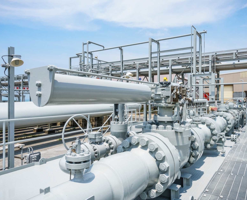 Side view of industrial piping facility