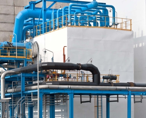 blue and black pipes at an industrial plant