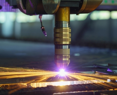 Plasma cutting machine cutting through thick metal sheet
