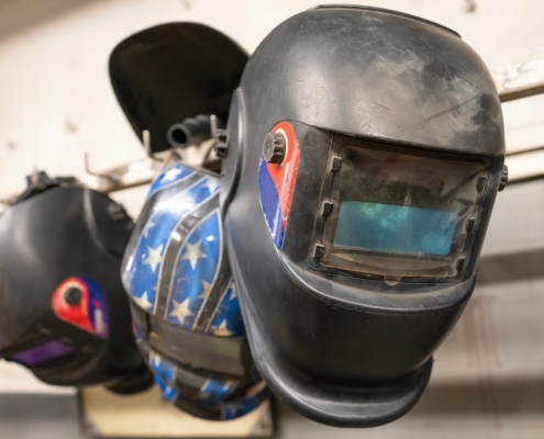 Welding masks hanging on wall