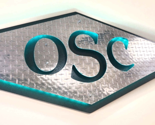 OCS Green sign thats handing in the office