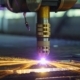Plasma cutting machine cutting through thick metal sheet