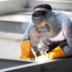 Welding work ,worker with protective welding metal on construction