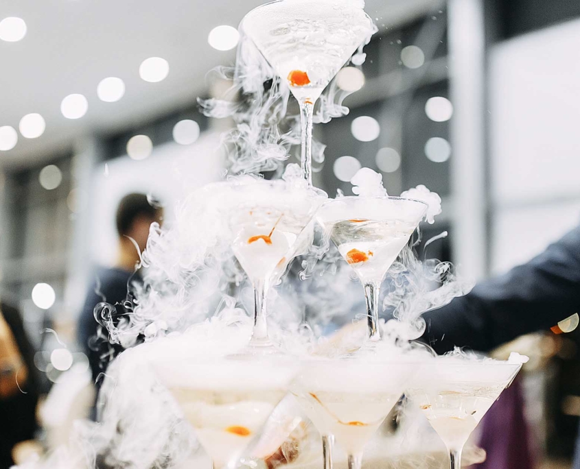 Party with a stack of drinks that have dry ice