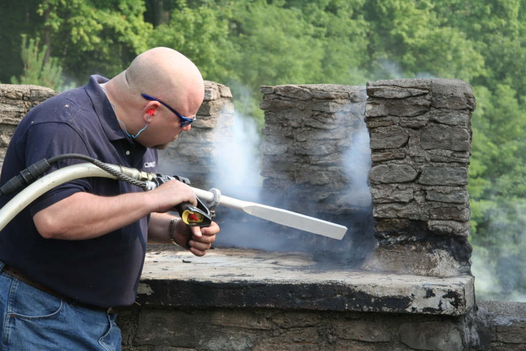 OSC team member using dry ice blasting