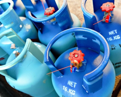 close-up view of blue gas containers and valves