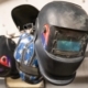 Welding masks hanging on wall
