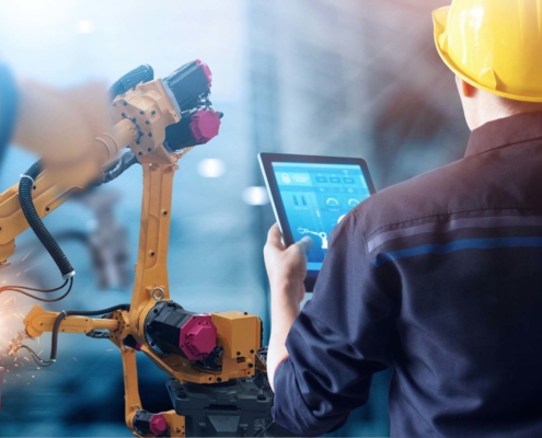 welding operator reviewing processes on a tablet