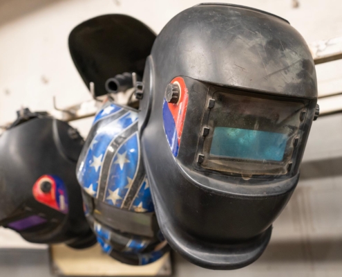 Welding masks hanging on wall