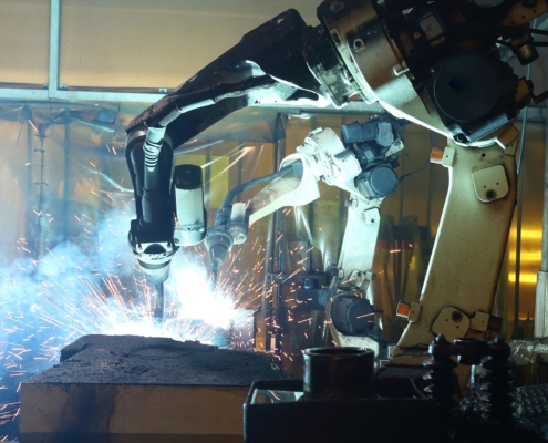 Automated welding machine in shop